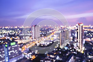 World environment day concept: Bokeh light and blur modern city skyline sunrise background