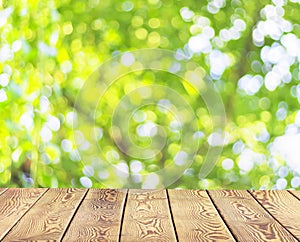 World Environment Day concept: Empty wooden table over blurred tree with bokeh background