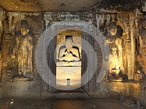 WORLD FAMOUS ANCIENT AJANTA CAVES ROCKCUT STRUCTURE WITH GAUTAM BUDDHASCULPTURE  IN INDIA photo