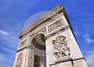 World famous Arce de Triomphe against a blue sky, Paris photo