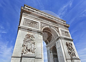 World famous Arce de Triomphe against a blue sky, Paris photo