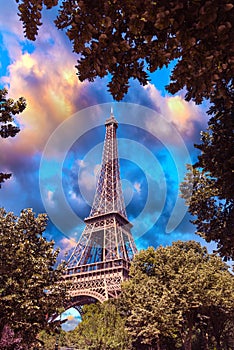 World famous Eiffel tower under a cloudy day at sunset