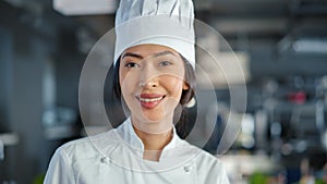 World Famous Restaurant: Portrait of Asian Female Chef Posing in Modern Professional Kitchen Turning