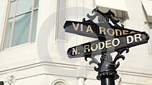 World famous Rodeo Drive symbol, Cross Street Sign, Intersection in Beverly Hills. Touristic Los Angeles, California, USA. Rich