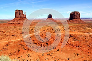 The world famous West Mitte Butte - East Mitten Butte and Merrick Butte in Monument Valley Park - beautfiful day with a clear blue