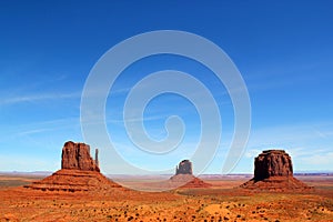 The world famous West Mitte Butte - East Mitten Butte and Merrick Butte in Monument Valley Park - beautfiful day with a clear blue