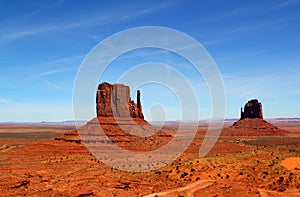 The world famous West Mitte Butte and East Mitten Butte in Monument Valley Park - beautfiful day with a clear blue sky to discover