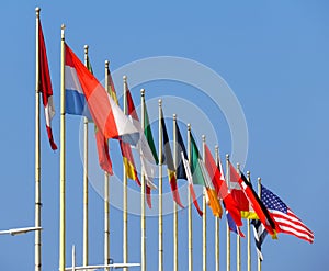 World flags against blue sky