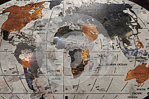 World Geographic Map Made of Metallic Material with the African Continent in the Foreground