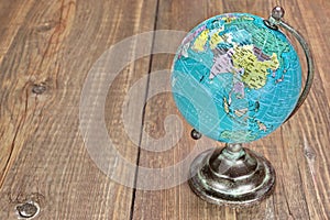 World Geographical Globe On The Wooden Table photo