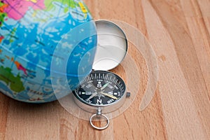 World Globe and compass on the wooden table