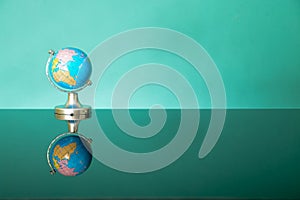 World globe on green background. Copy space.Earth day or environment conservation concept. Save green planet concept