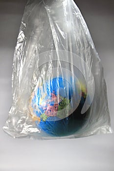 World globe in isolation under plastic cover covid-19 worldwide pandemic.