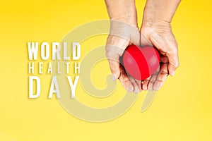 World health day concept Healthcare medical insurance with red heart on senior woman`s hands support