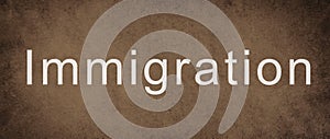 The world immigration is standing on a brown colored wall, refugees Europe, asylem seekers