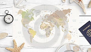 World map, compass, passport and shells. Concept of travel planning