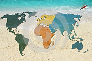 World map and compass on sea background