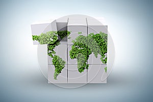 World map on the cube in green environment concept - 3d renderin