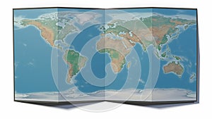 World map drawn on a folded sheet, planisphere leaning on a surface. Physical map photo