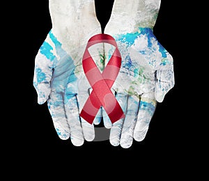 World map on hands with red ribbon , world aids day concept ,Elements furnished by NASA