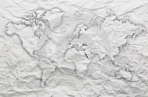 World map outline on white crumpled paper