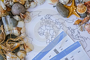 World map, seashells and pebbles boarding pass. Travel vacation concept. Summer sea holidays. Tourism and resorts.