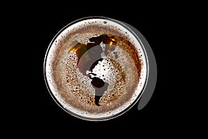 World map shape on foam in glass of beer