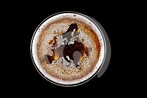World map shape on foam in glass of beer
