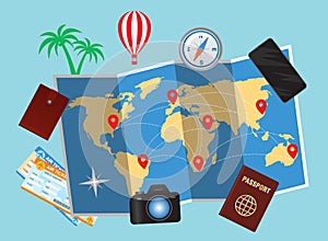 World map and traveller personal belongings over blue background