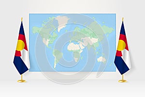 World Map between two hanging flags of Colorado flag stand