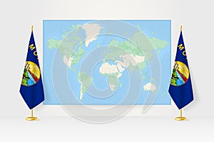 World Map between two hanging flags of Montana flag stand