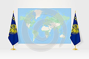 World Map between two hanging flags of Oregon flag stand