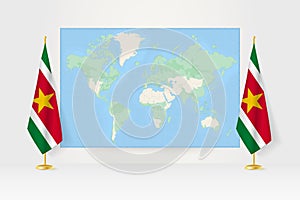 World Map between two hanging flags of Suriname flag stand