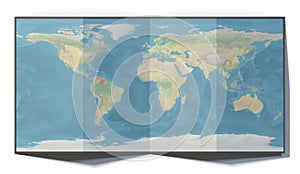 World map, Venezuela, drawn on a folded sheet, planisphere leaning on a surface
