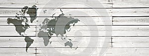 World map on white wooden wall background. Horizontal banner