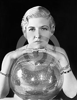 The world might be her oyster, but this young woman seems, leaning on her crystal ball