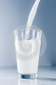 World Milk Day, pouring into glass on marble table