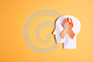 World Multiple Sclerosis Day. Orange awareness ribbon and brain symbol on a yellow background