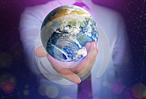 World in our hands. Man holding digital model of Earth, closeup view