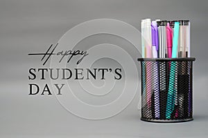 World Philosophy Day. Stack of books with pens and lettering on white background.