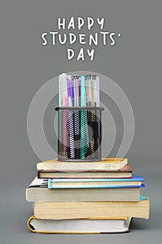 World Philosophy Day. Stack of books with pens and lettering on white background.