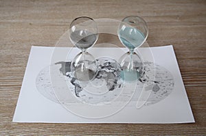 World political map and two sandglasses