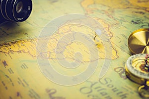 World retro map - focusing on South America close-up. Vintage tone style.with accessories compass and camera
