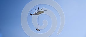 The world`s largest cargo helicopter hovers overhead. Bottom view