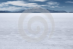 The world's largest salt flat and dormant volcano Tunupa at the far background