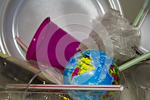 World surrounded by plastic trash. Plastic pollution concept