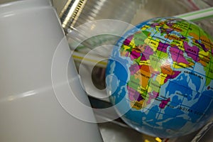 World surrounded by plastic trash. Plastic pollution concept