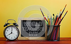 World Teacher`s Day Text. Alarm Clock, Blackboard and School Sta
