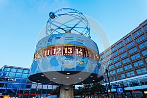 World time clock on Alexanderplatz in Berlin, Germany, at dusk