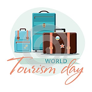 World Tourism Day, 27 September. Travel suitcases with stickers.